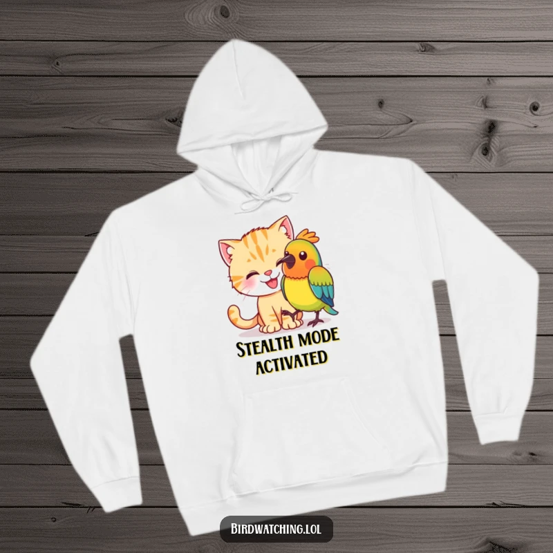 Funny, stealthy cat trying to sneak up on a colorful bird, featured on a warm hoodie.