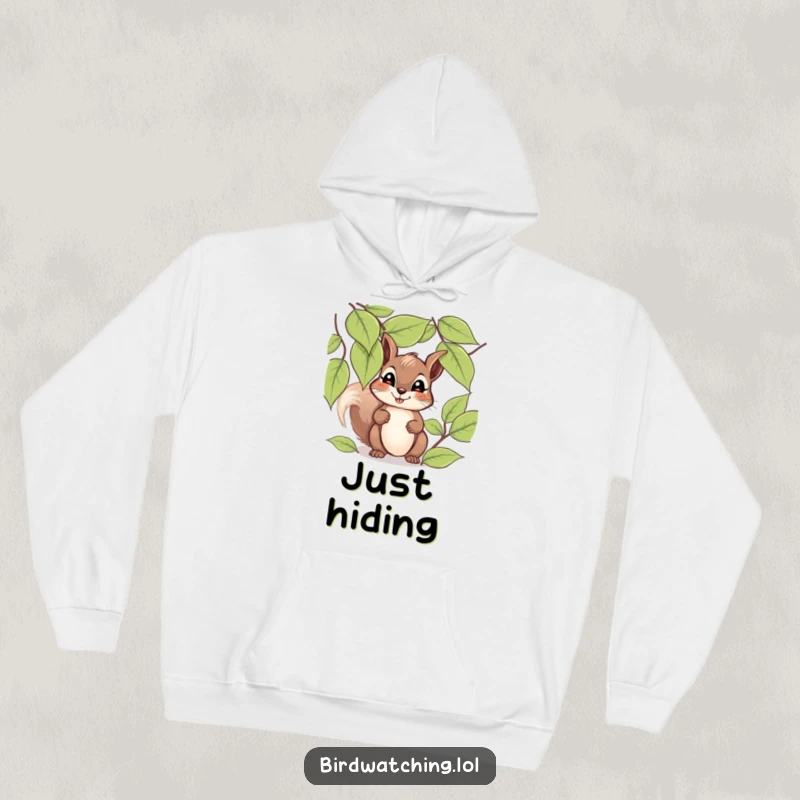 Funny giggling squirrel hoodie featuring a happy squirrel peeking through leaves with a hopeful expression, great for warmth.
