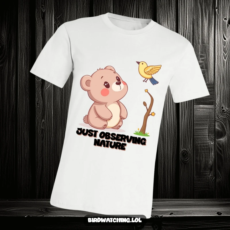 Funny T-shirt with a bear captivated by a bird, illustrating a moment of innocent wonder and humor, making it a unique gift item.